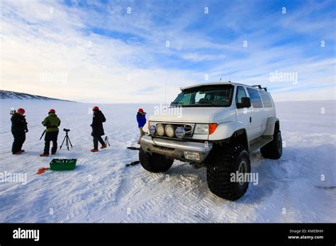 Tourists visiting Crystal ice cave in Breidamerkurjokull glacier ...