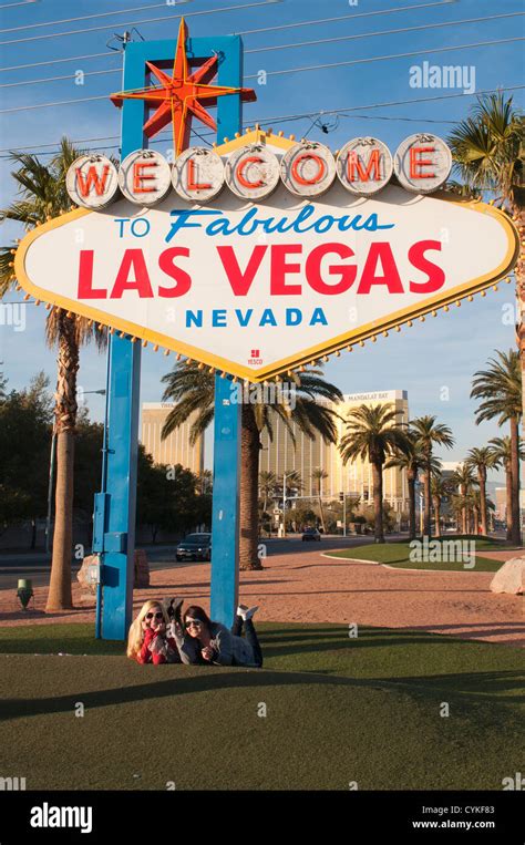 Girls Posing Under The World Famous Welcome To Fabulous Las Vegas Sign