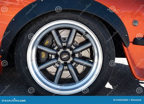 details   wheels   classic orange japanese datsun  parked