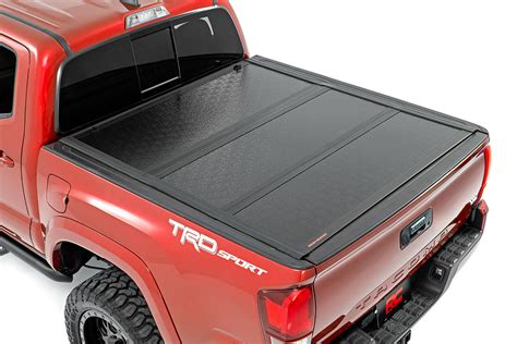 toyota tacoma   profile hard tri fold bed cover rough