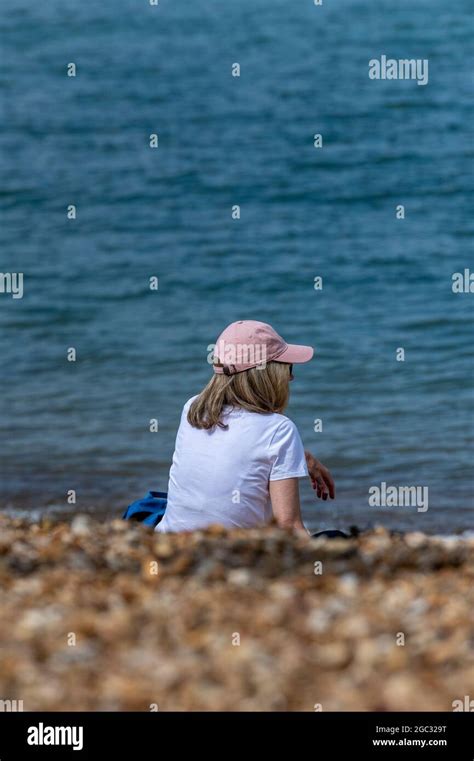 Woman On Beach Woman Wearing Baseball Cap Woman On Seashore Female