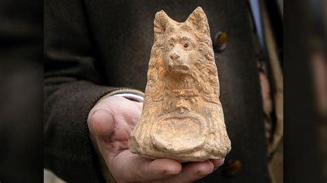 Ancient dog-headed statue found during Roman road excavation | Live Science