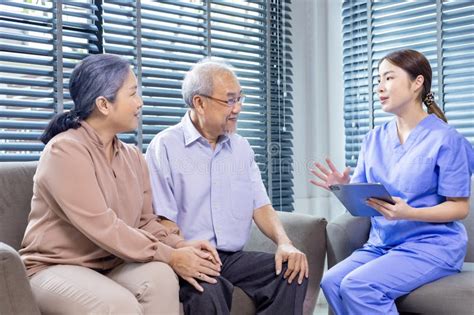 Senior Asian Couple Having Appointment With Doctor For Annual Health