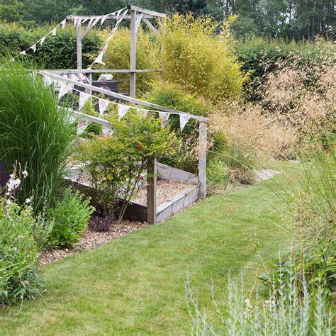 Can you water grass in the sun? Experts explain | Ideal Home