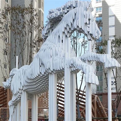 artist creates striking metal sculptures  stacked pipes