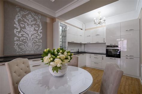 Premium Photo | Luxury white modern kitchen with dining table