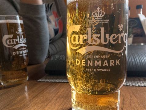 Logo Of Carlsberg On A Beer Glass With Its Distinctive Visual