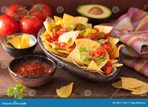 Nachos Loaded With Salsa, Guacamole, Cheese And Jalapeno Stock Image - Image of cilantro, pepper ...