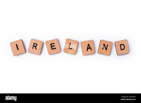 The Word Ireland Spelt With Wooden Letter Tiles Over A Plain White