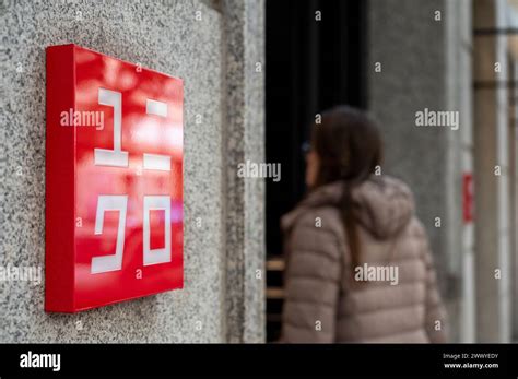 A customer enters the Japanese clothing brand Uniqlo store Stock Photo ...