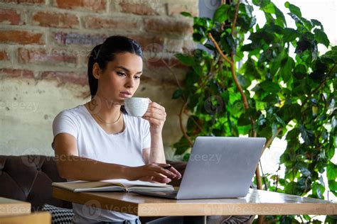 Young Businesswoman Is Working In A Cafeteria In Her Breakwoman Taking