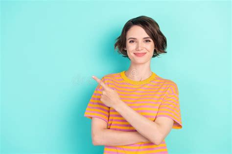 Photo Of Charming Sweet Young Lady Wear Orange T Shirt Pointing Finger