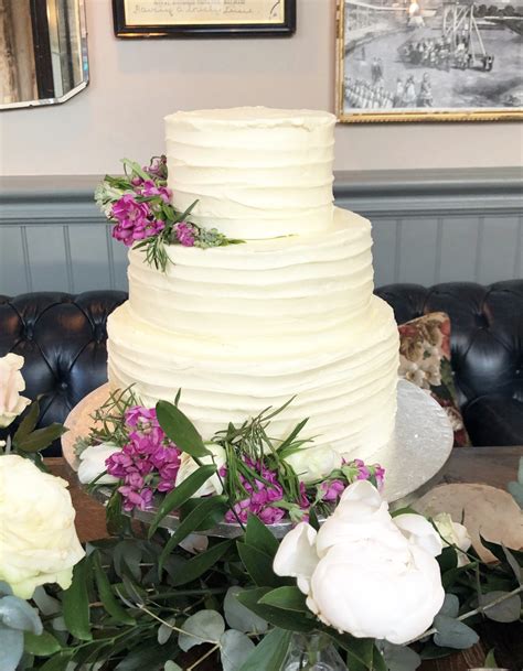 Buttercream Wedding Cake With Fresh Flowers Etoile Bakery