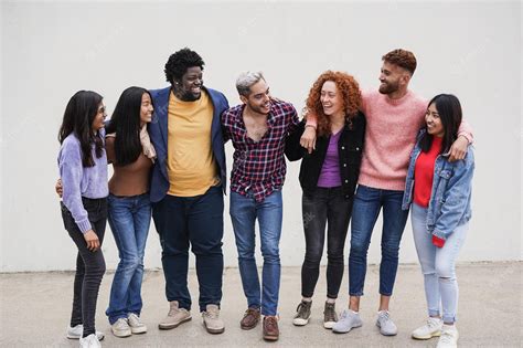 Premium Photo Group Of Multiracial Young People Hugging Each Other In