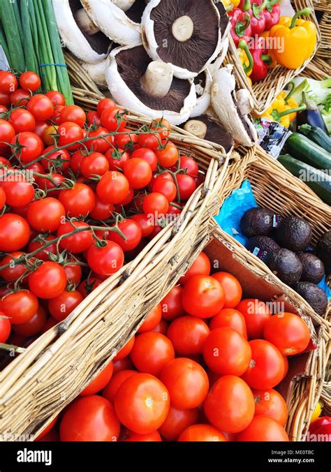 An Outdoor Market Stall Laden With A Variety Of Fresh Organic Fruit