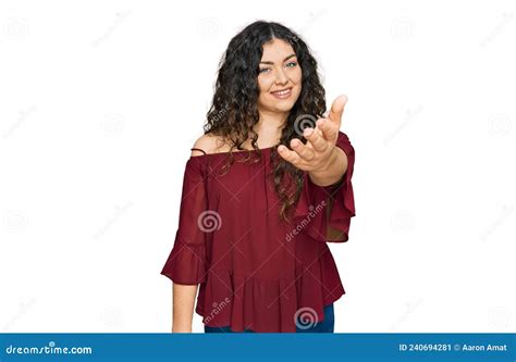 Young Hispanic Girl Wearing Casual Clothes Smiling Friendly Offering