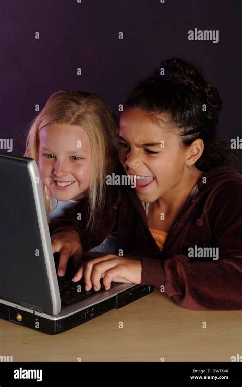 Girls playing computer games. Model released Stock Photo - Alamy