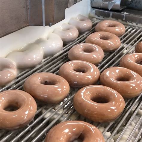 Doughnuts Being Made On A Conveyor Belt