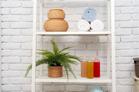 Premium Photo Rolled Fluffy Towels On Shelf In Bathroom