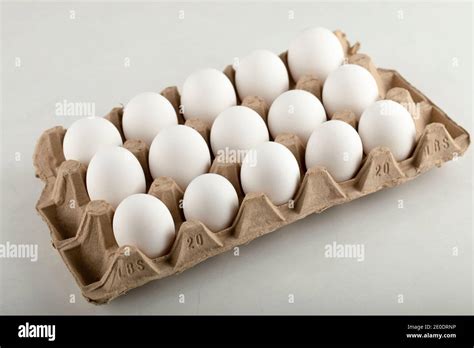 Raw Chicken Eggs In Egg Box On A White Background Stock Photo Alamy