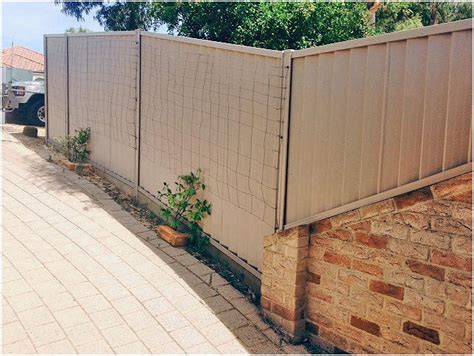 Colorbond fence installation on uneven/ sloped landscape. - Perth Trade ...