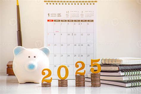 2025 New year saving money and financial planning concept. gold wooden