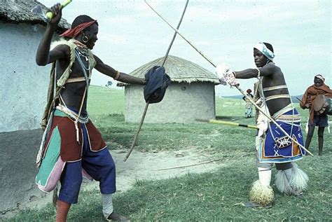 Young Xhosa Men Engaging In A Traditional Stick Fighting Contest South