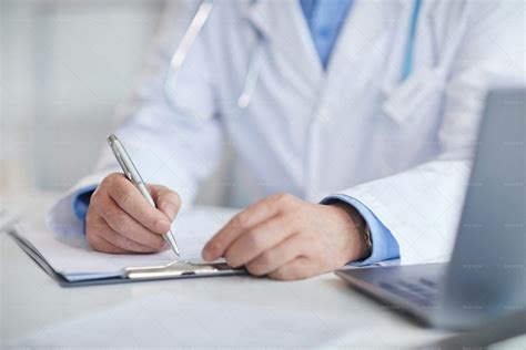 Doctor Writing In Patients Chart Stock Photos Motion Array