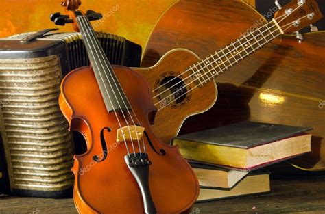 Violin, guitar and books on still-life wooden background — Stock Photo ...