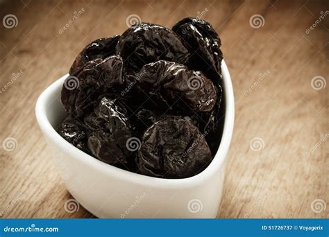 Dried Plums Prunes In White Bowl On Wooden Table Stock Image Image Of