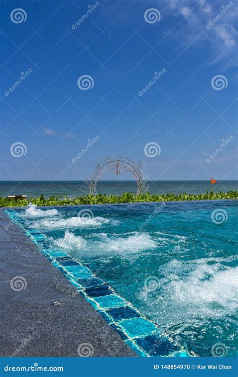 An Infinity Pool with Jacuzzi at a Beach Resort Stock Photo - Image of ...