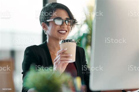 Shot Of An Attractive Young Businesswoman Sitting Alone In The Office