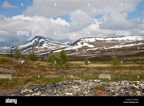 Landscape with snowy mountains Stock Photo - Alamy