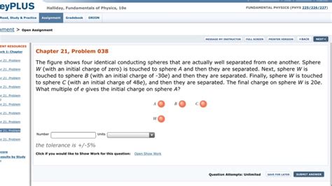 Solved The Figure Shows Four Identical Conducting Spheres Chegg