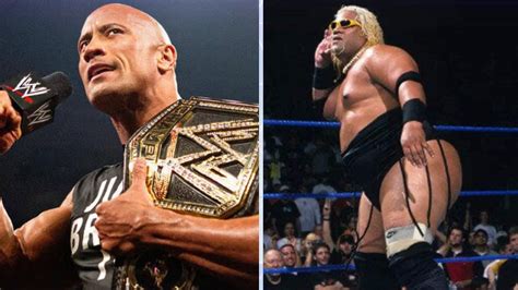 The Rock hugs Rikishi before being presented with new WWE championship