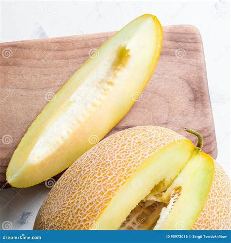 Ripe Big And Yellow Melon Cut Into Pieces Appetizing Background