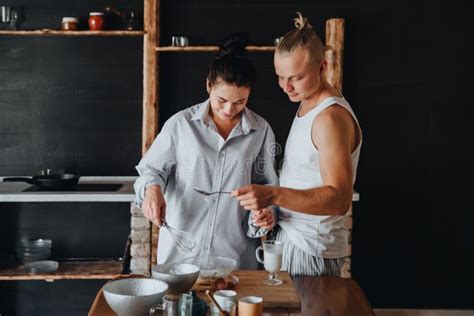 Young Couple In Love Cook Healthy Food In The Kitchen Together Stock