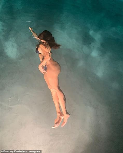 Kourtney Kardashian Shows Off Her Pert Derriere In A Racy Thong Bikini On A Night Swim Daily