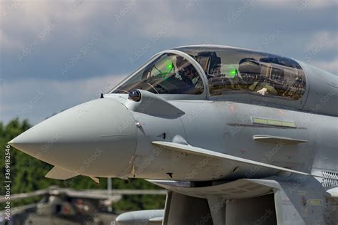 Two military pilots in the cockpit of a modern military fighter jet as ...