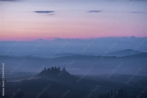 Podere Belvedere House On A Hills In Tuscany In Italy At Sunrise With