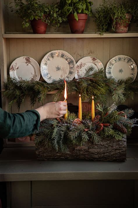 Celebrate The Winter Solstice With A Traditional Yule Log Under A Tin