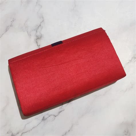 Red clutch bag on Carousell