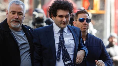 Sam Bankman Fried Disgraced Crypto King Sent To Jail In Handcuffs After His Bail Is Revoked