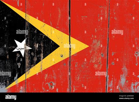 Flag Of East Timor Or Timor Leste On An Old Rustic Wooden Door Stock