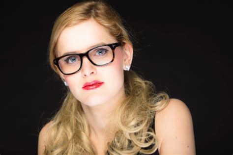 Pretty Woman With Red Lipstick And Blond Hair Wearing Glasses Stock