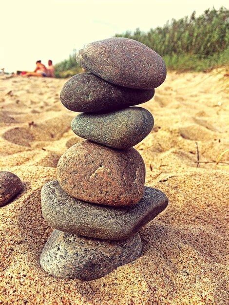 Premium Photo Stack Of Stones On Beach