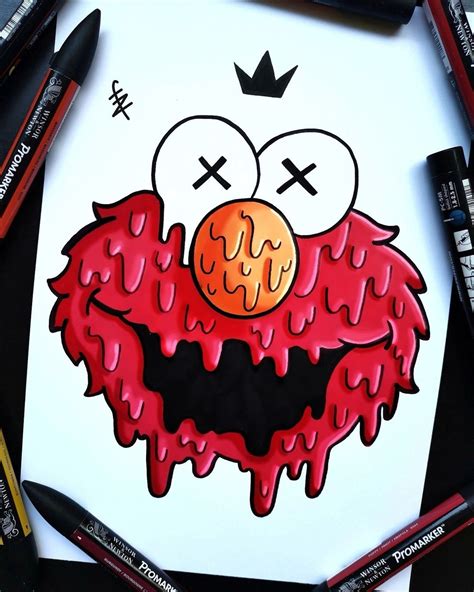 a drawing of an evil monster with eyes and mouth covered in red paint, surrounded by crayons