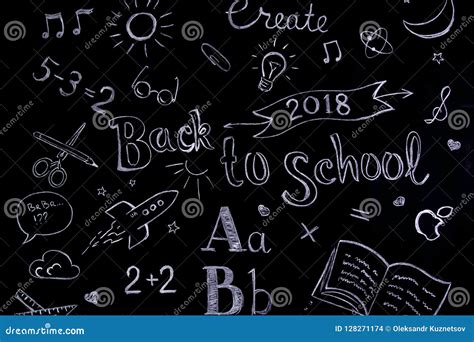 Handwritten School Concept On Blackboard Written With Chalk Back To