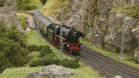 Model railroad layout in HO scale with steam locomotives and steam trains