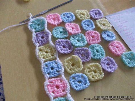 Crocheted Squares Are Laid Out On A Table